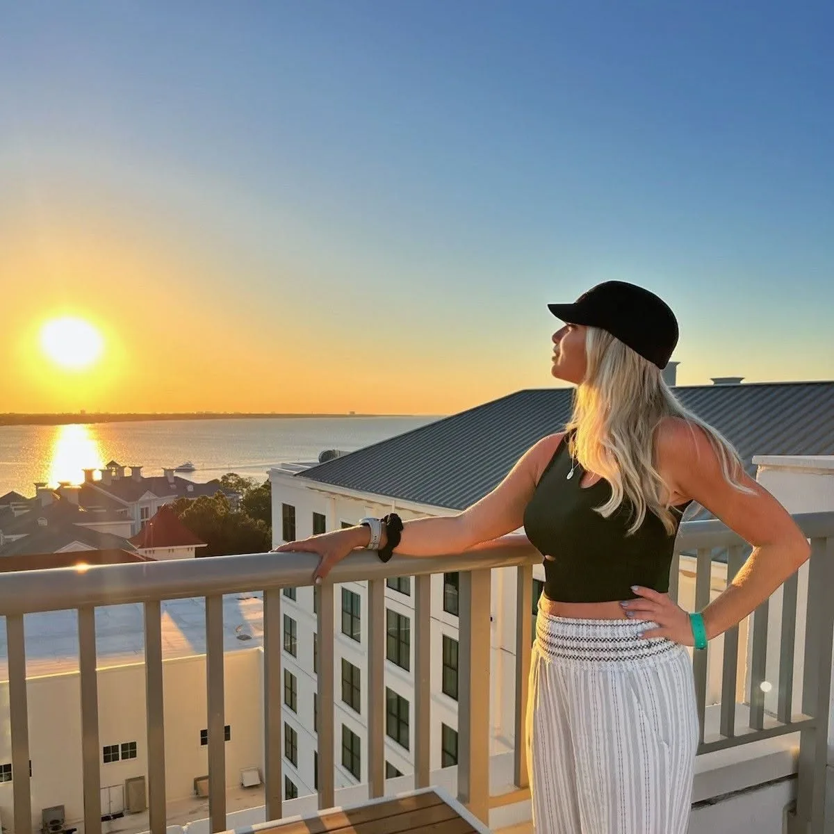 Jeannie Pope, founder of Knot His, watching the sunset over the water